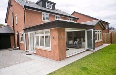 A large brick house with a living room and a patio